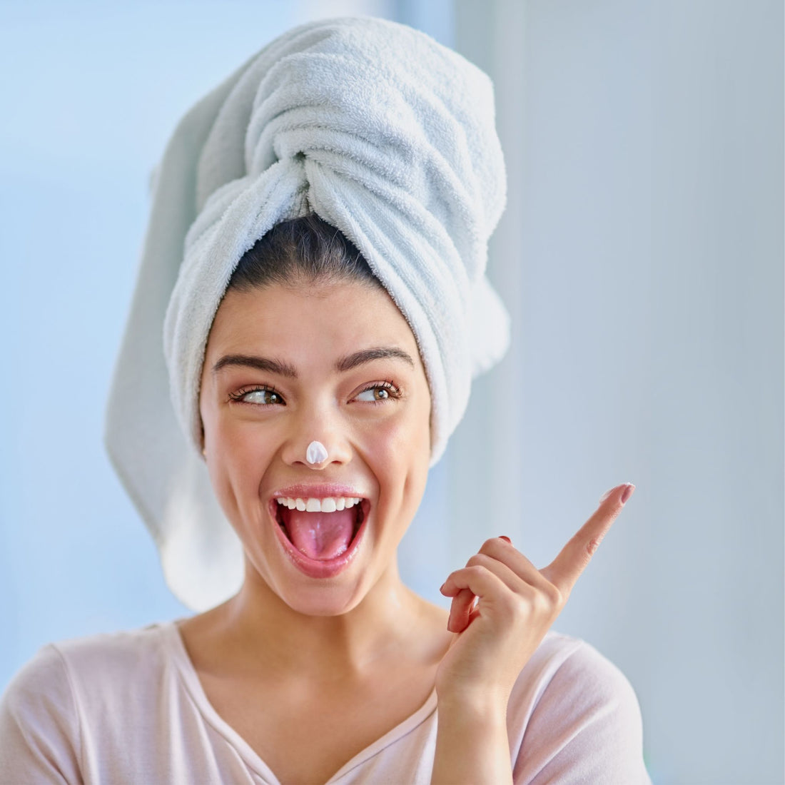 vegan woman applying vegan skincare