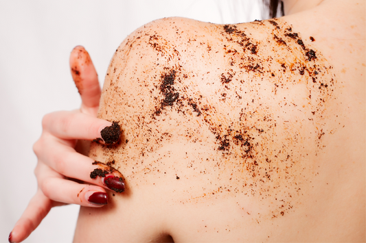 A woman exfoliating her skin