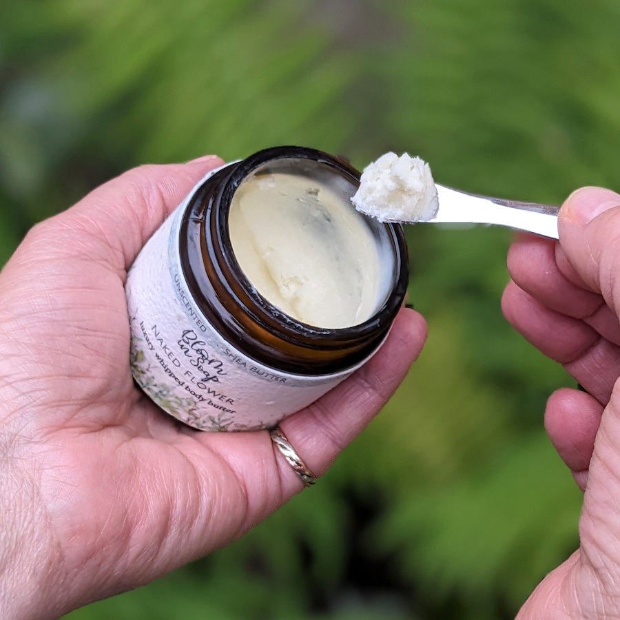 jar of whipped body butter with silver scoop