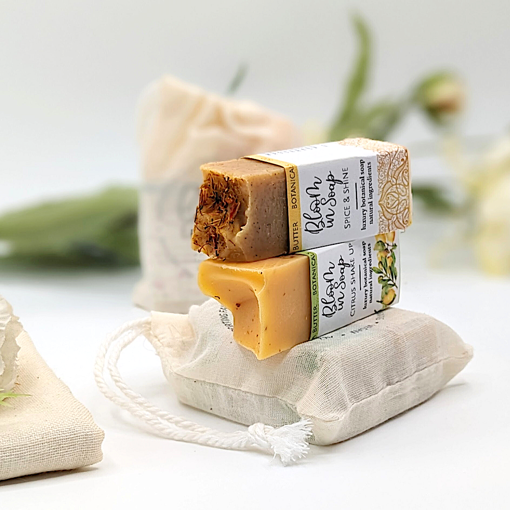Two bars of natural soap in a linen gift bag