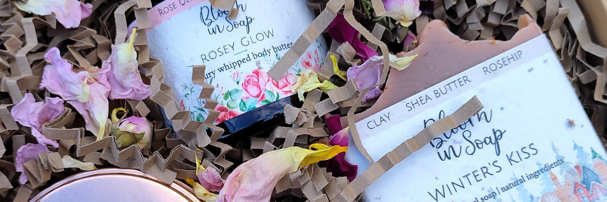 gift box with natural soap bar, candle and luxury body butter
