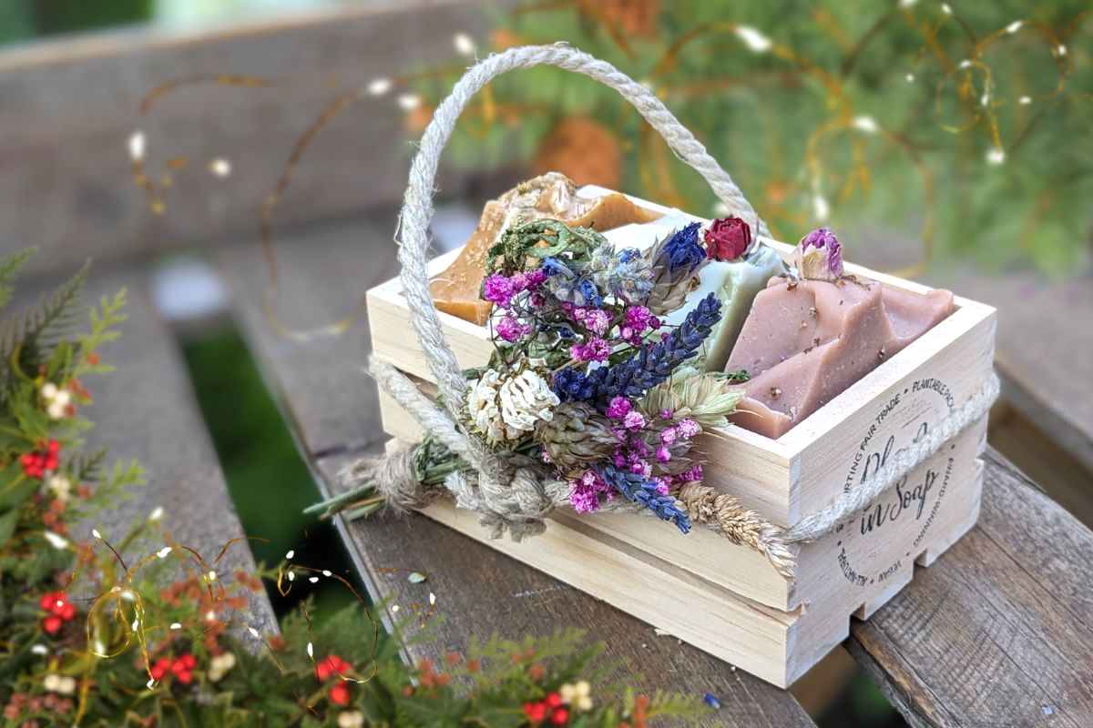 A wooden crate filled with natural soaps