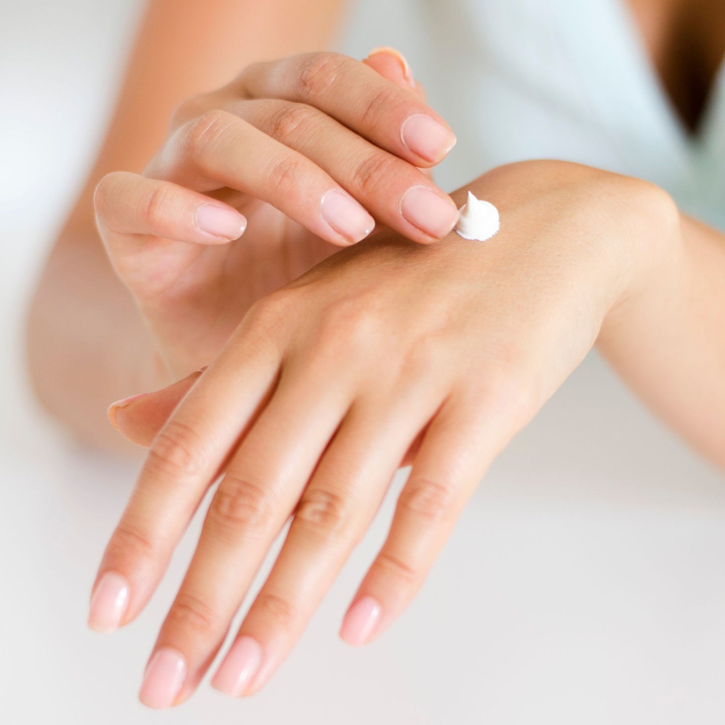 woman applying luxury hand cream