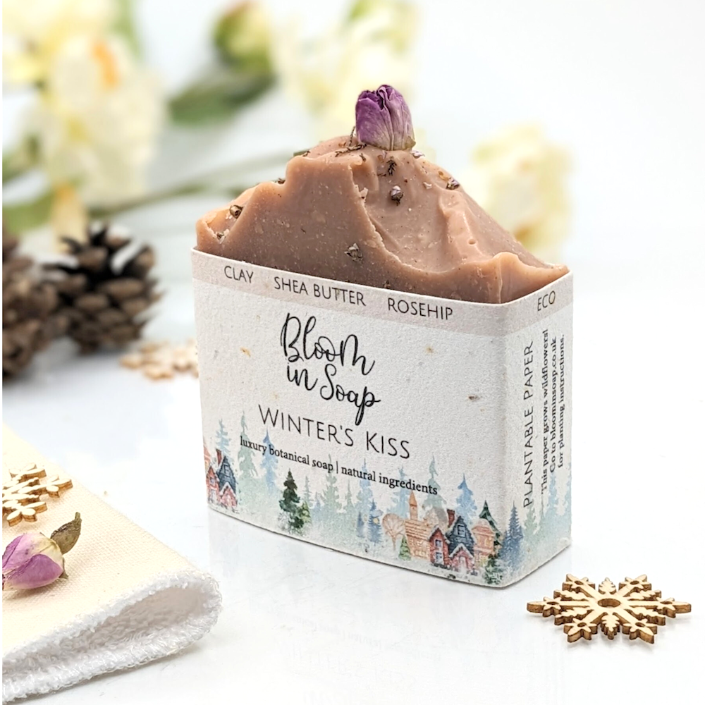 Pink natural soap bar with a dried rose bud on top from Bloom In Soap