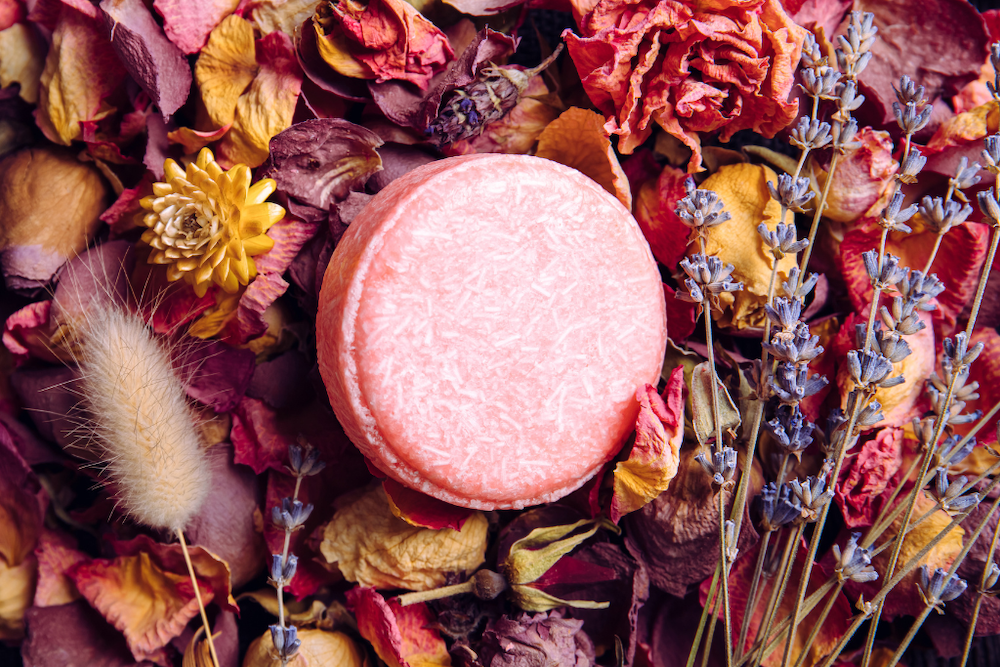 pink solid shampoo bar with botanicals