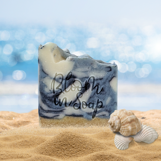 a bar of sea kelp soap on the beach