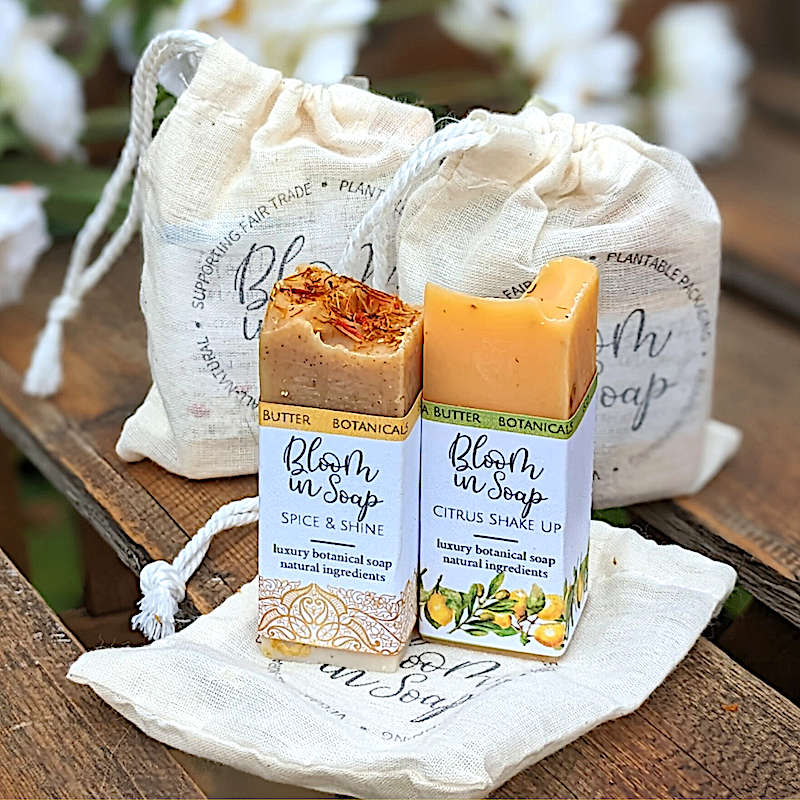 Two bars of handmade soap in a linen gift bag