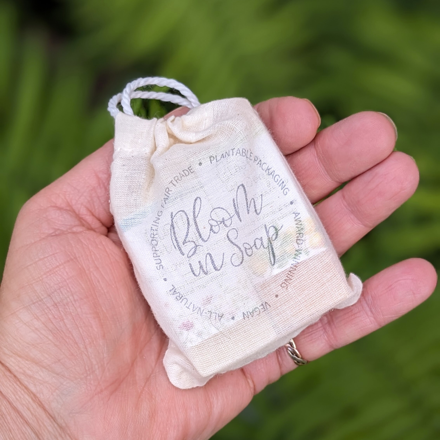 A linen gift bag with soap from Bloom In Soap