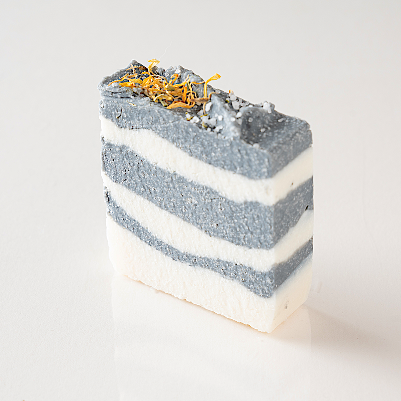 a bar of natural salt soap made with activated charcoal and sea salt