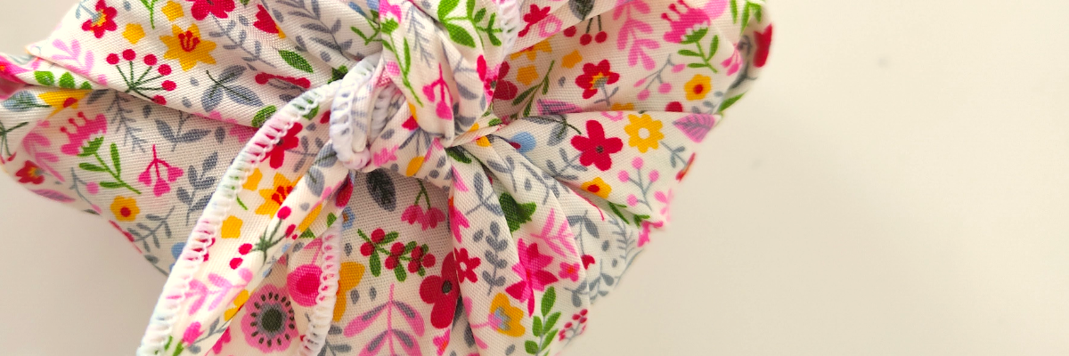 Furoshiki fabric gift wrap printed with pink wildflowers