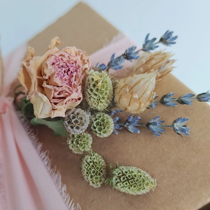 handmade soap gift box tied with ribbon and decorated with dried flowers
