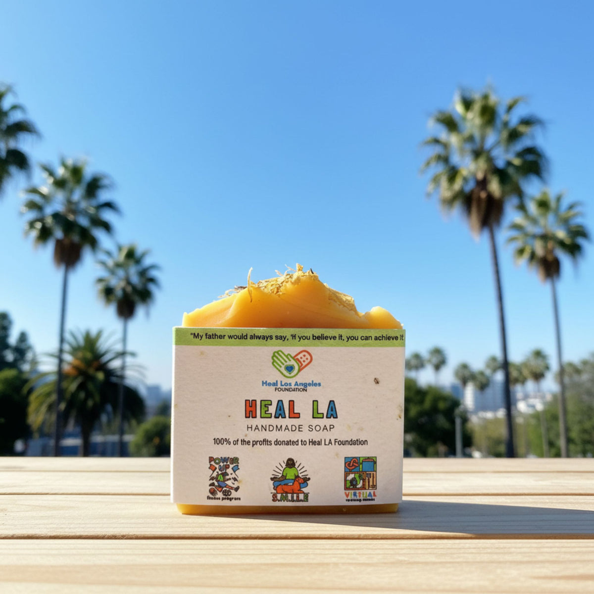 HEAL LA handmade soap with palm trees and blue sky in the background