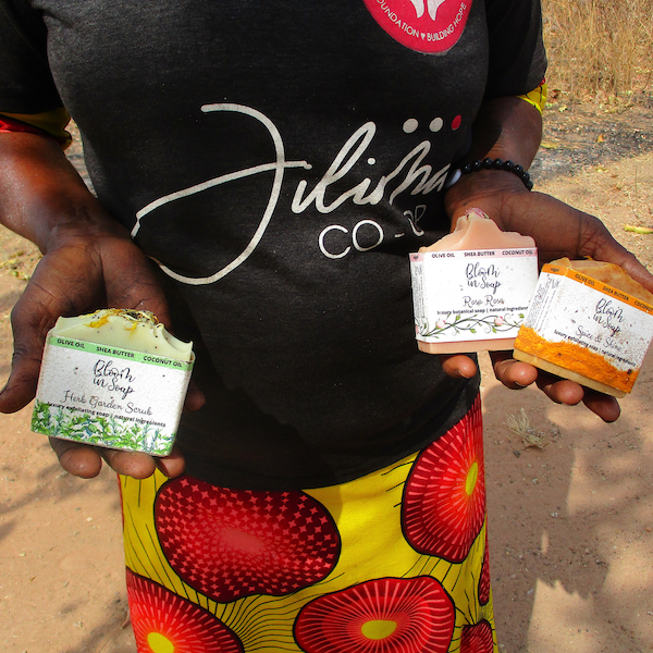 Ghanaian woman holding natural soaps