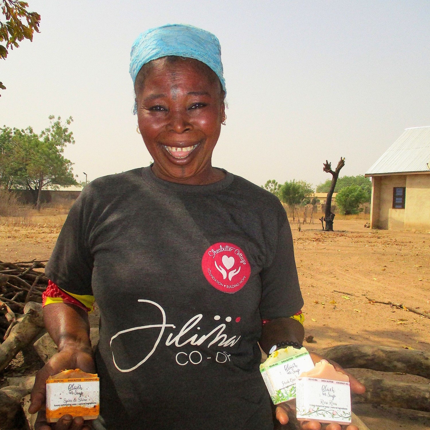 Woman holding soap bars with Jilima Co-op text in Ghana