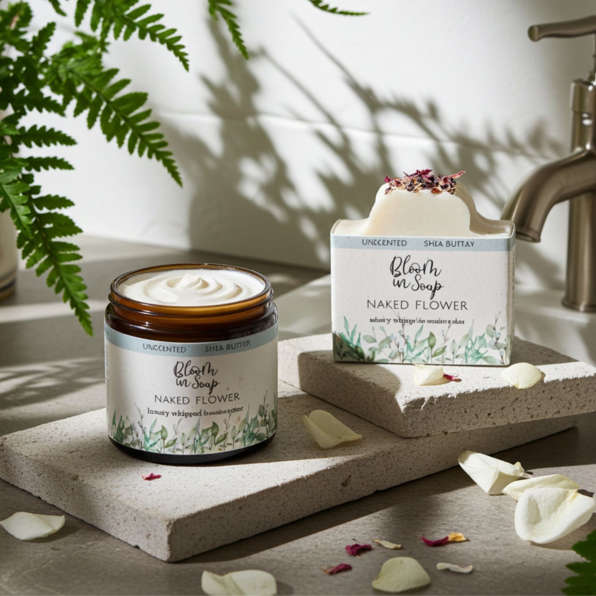 Bath products including a jar and soap bar on a stone surface with plants and water faucet in the background.