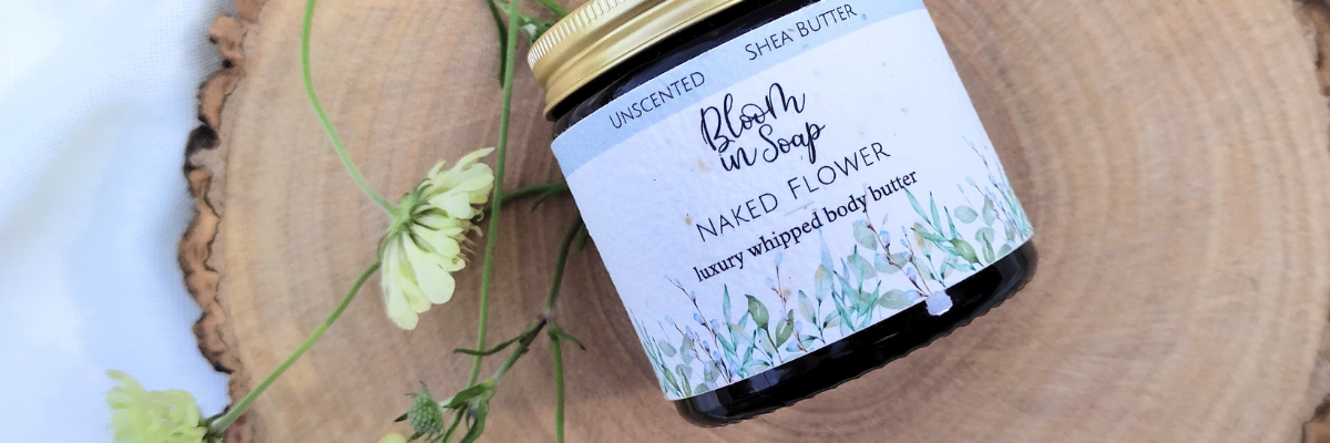 a jar of naked flower unscented body butter