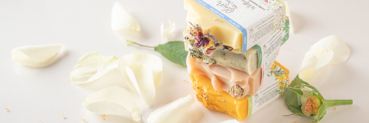 Bars of soap with plantable packaging on a white background