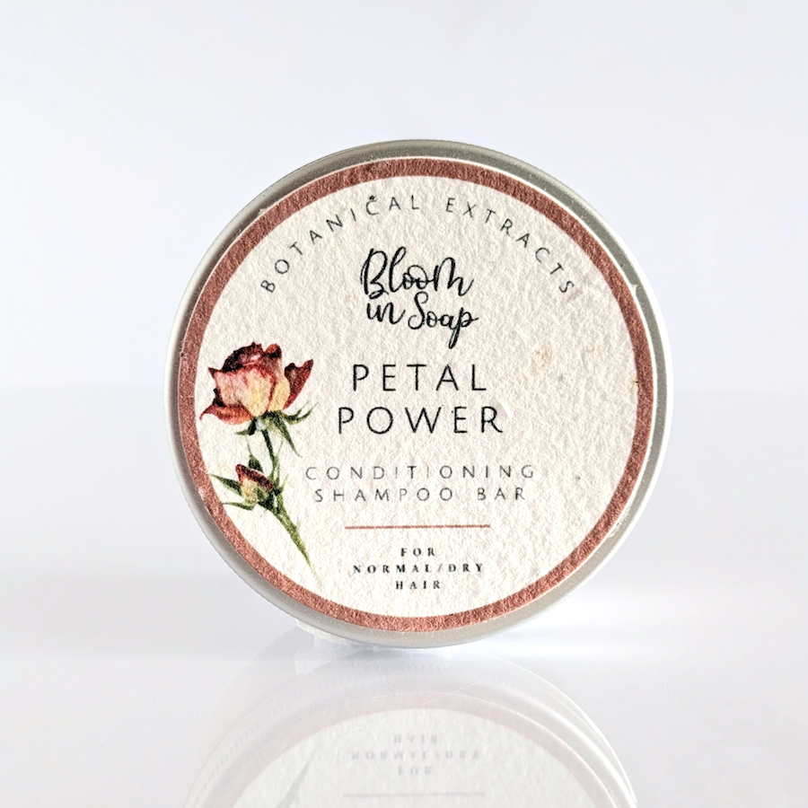 Petal Power solid shampoo bar in an aluminium tin