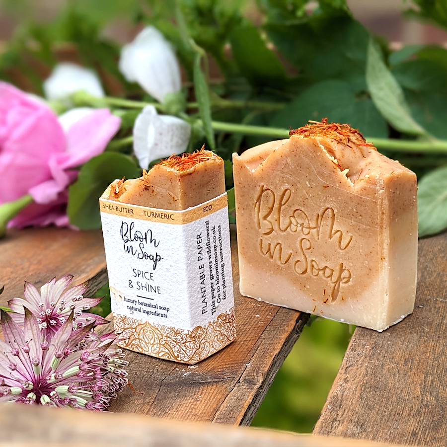 Turmeric handmade soap on a wooden tray with plants