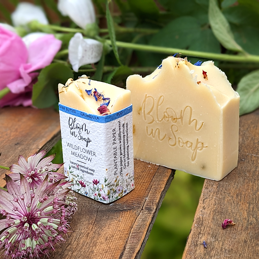 Wildflower yellow handmade soap on a wooden tray with botanicals